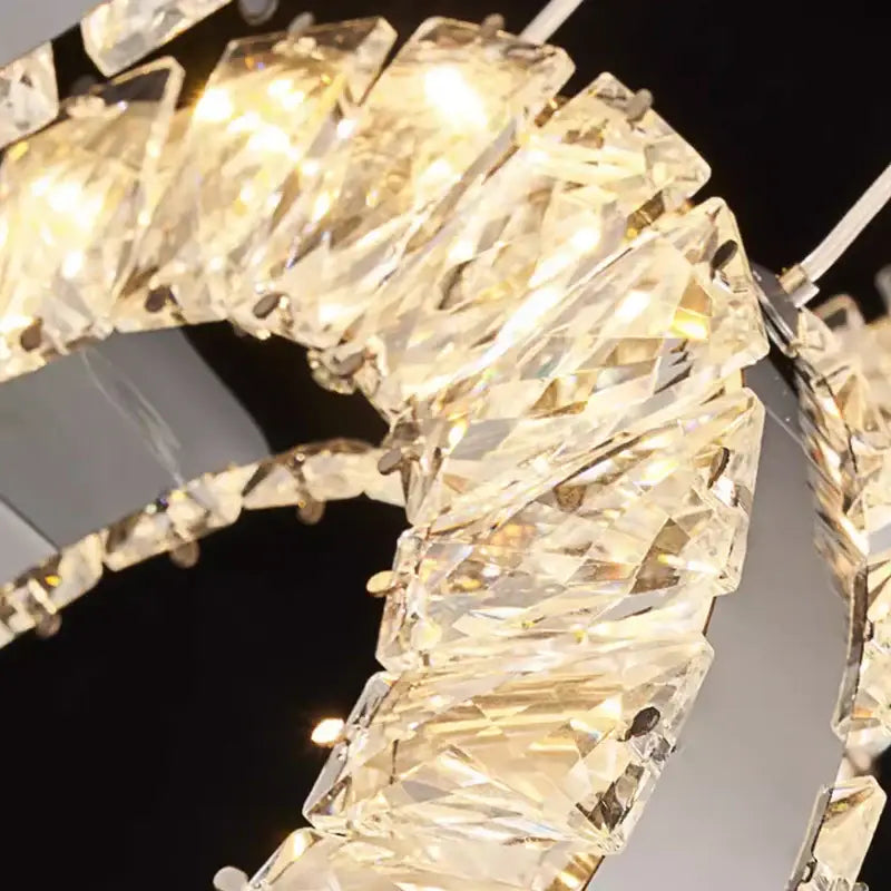 A modern decorbites led pendant crystal chandelier with clear faceted glass crystals for indoor lighting
