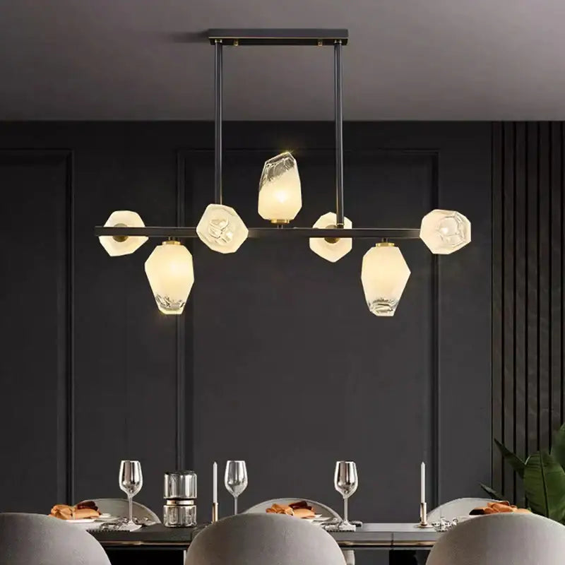Modern black metal decorbites led pendant chandelier with faceted warm-toned glass shades for living and dining rooms