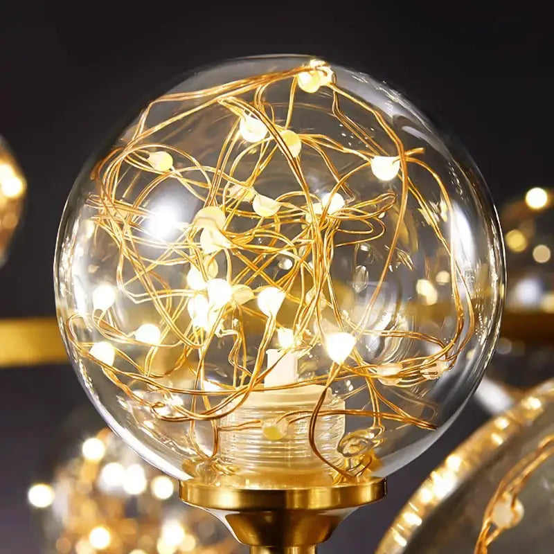 Decorbites led pendant light chandeliers featuring golden filament string lights in clear glass globe with brass base