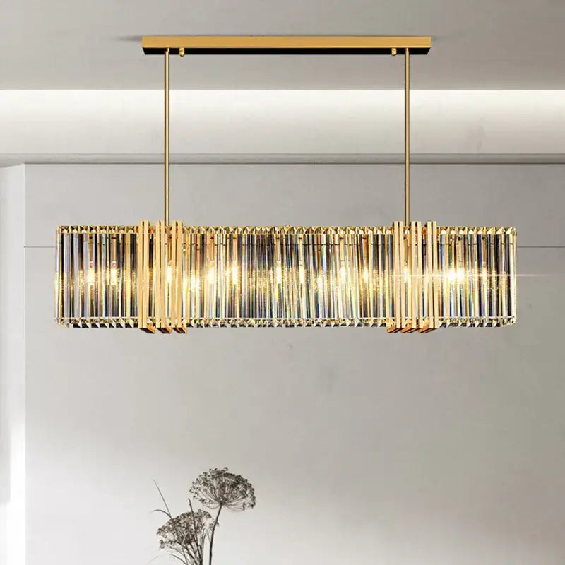 Gold-toned decorbites led pendant light chandelier with vertical crystal rods and warm glowing lights for modern decor