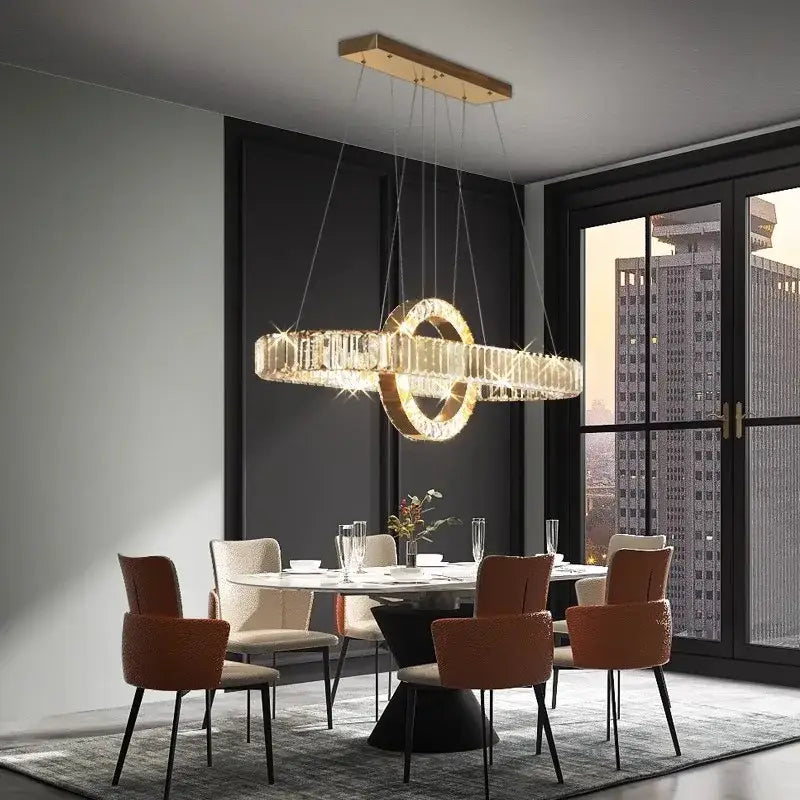 Gold-toned decorbites led pendant light chandelier with circular crystal accents for modern indoor lighting and dining room decor