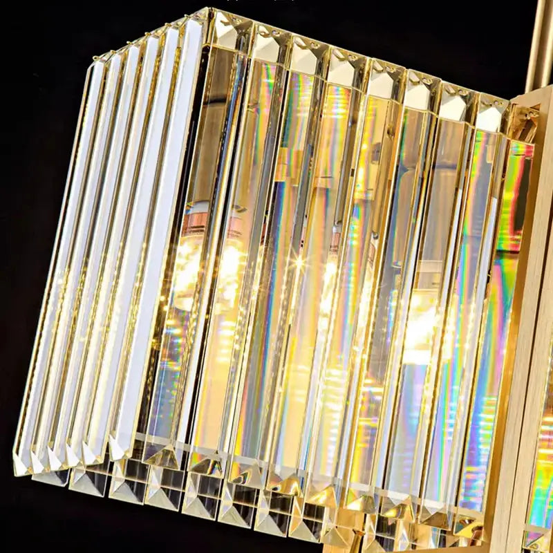 A decorbites led pendant cube chandelier with gold metal frame and crystal prisms refracting colorful light for modern decor