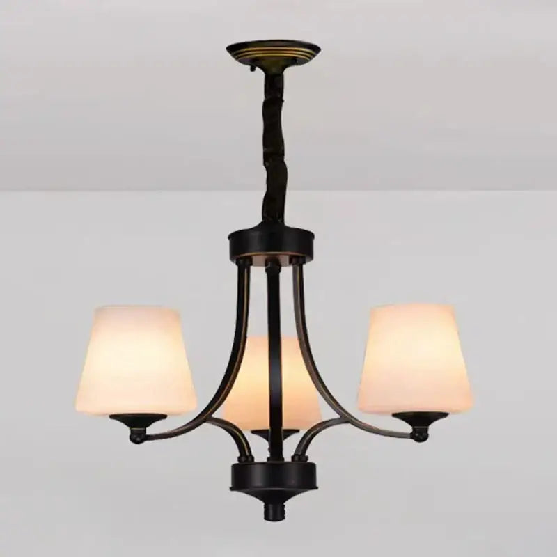 Black wrought iron DecorBites led pendant chandelier with three warm frosted glass shades for modern living room lighting