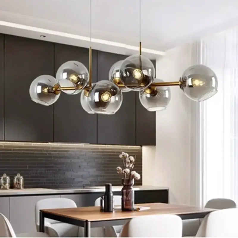 Modern brass decorbites led pendant light chandelier with clear glass globe shades for living and dining rooms