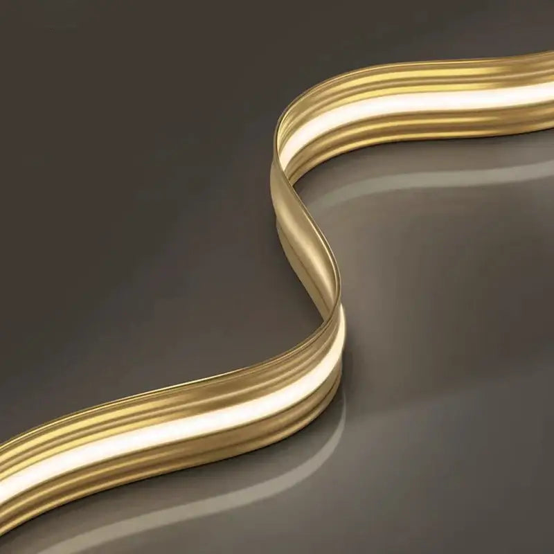 A sleek curved gold metallic strip with a smooth reflective surface from decorbites led pendant light chandelier