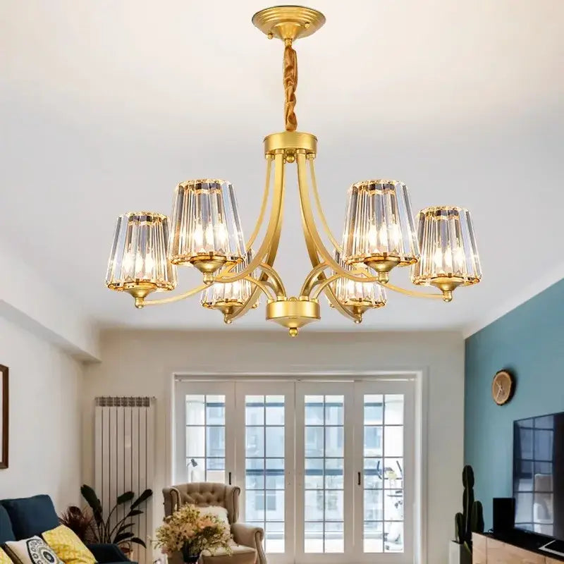 Gold-toned decorbites led pendant light chandelier with six crystal encased fixtures and twisted brass chain for modern rooms