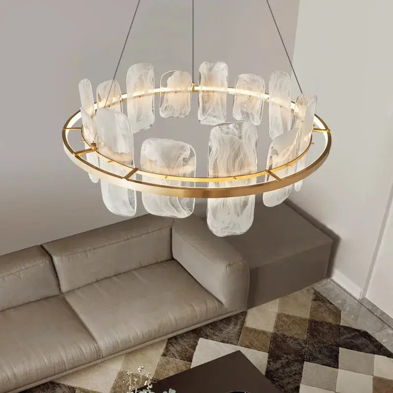 A modern decorbites led pendant chandelier with gold metal frame and ice-like glass panels for living and dining rooms