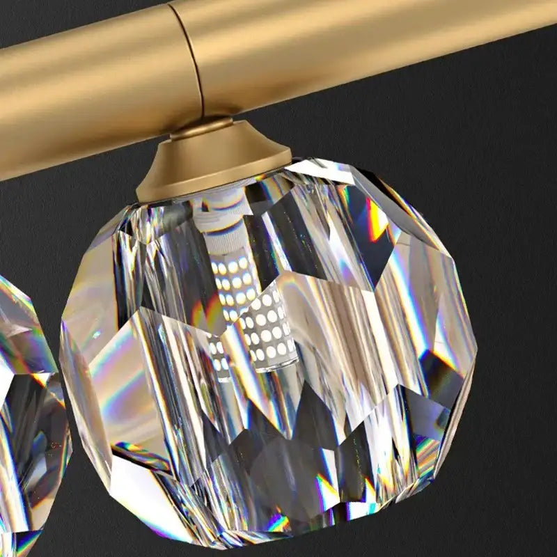 DecorBites led pendant light featuring a faceted crystal globe with gold-toned metal for modern living and dining rooms