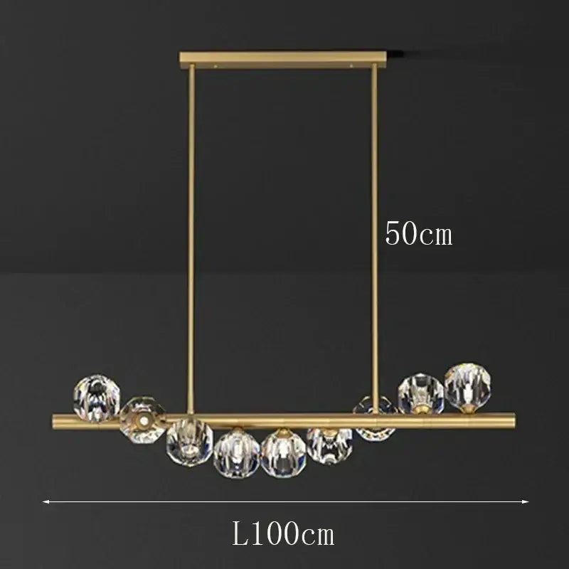 Gold-toned decorbites led pendant light chandelier with a sleek rectangular frame and clear crystal spheres for modern spaces