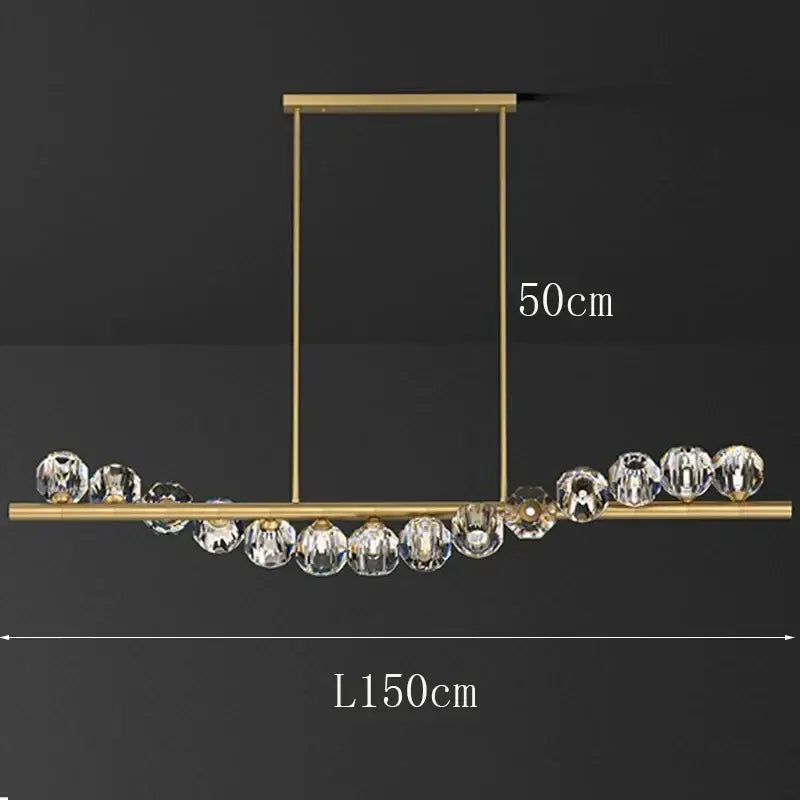 Gold-toned decorbites led pendant light chandelier with sleek bar and faceted crystal spheres for modern dining room lighting