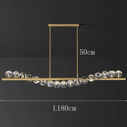 Gold-toned DecorBites led pendant light chandelier with clear crystal spheres for modern living and dining rooms