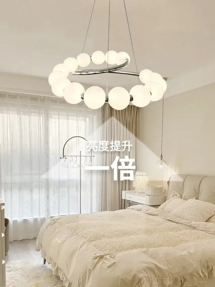 Modern chrome-finished DecorBites™ pendant light chandeliers with frosted glass globe lights for living and dining rooms