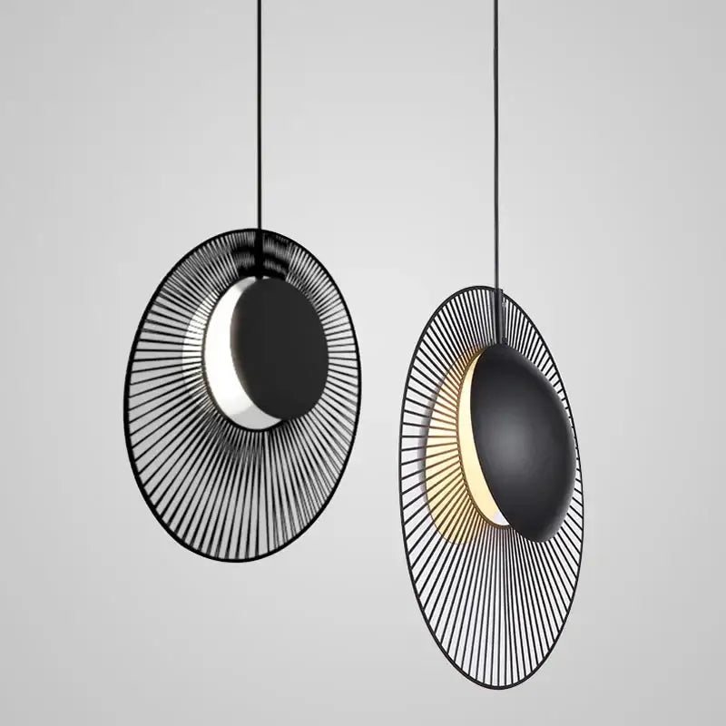 Black circular DecorBites led pendant light with radial wireframe design and illuminated crescent center for loft decor