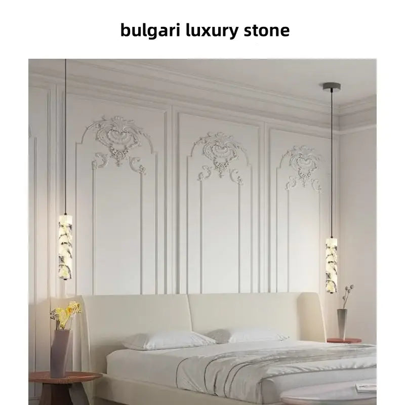 Bulgari luxury pendant light fixture with elegant marble stone cylindrical shades and sleek black cords by DecorBites™