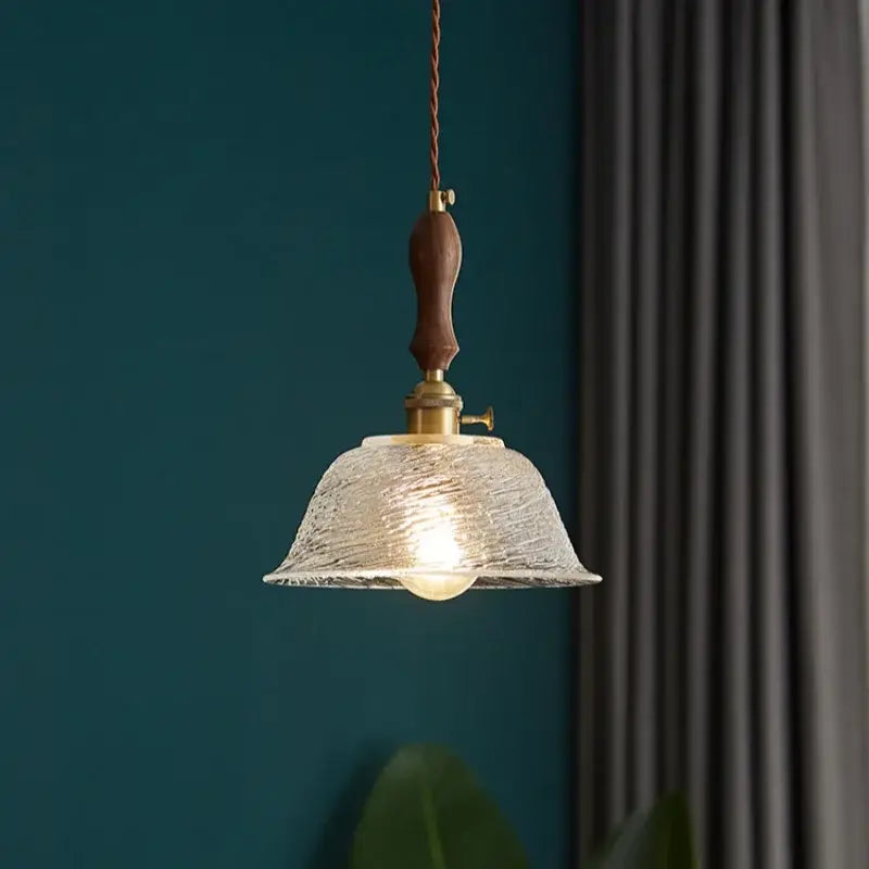 Decorbites led pendant light featuring a warm translucent glass shade and dark wood handle in a modern design