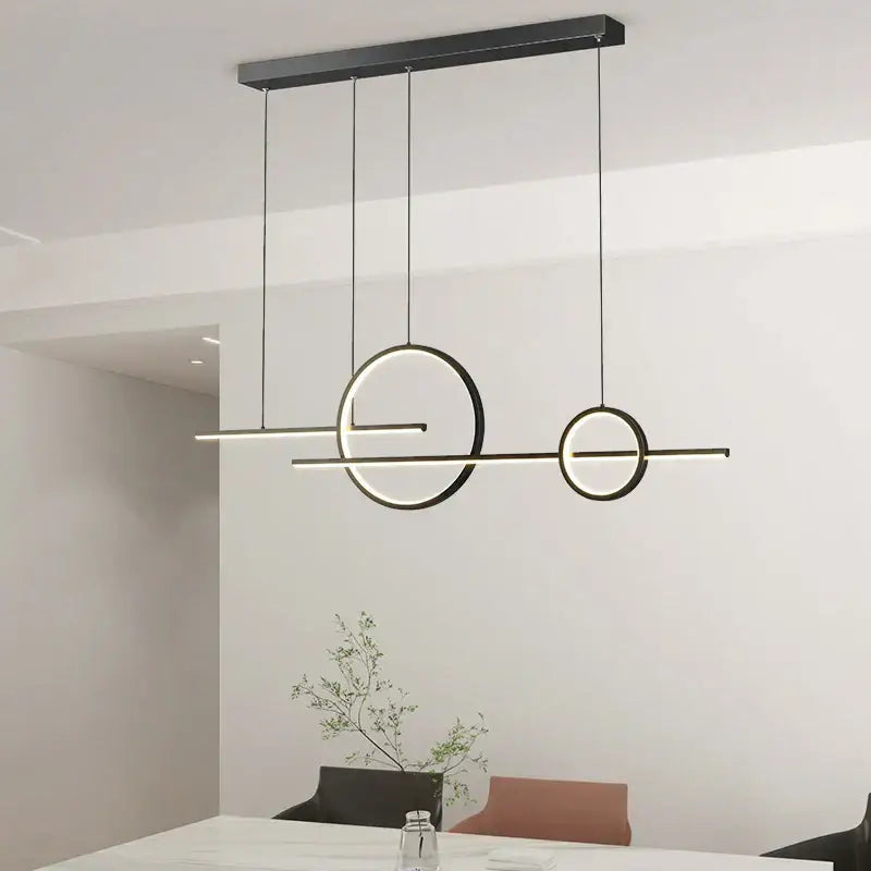 Modern black minimalist DecorBites LED pendant light with sleek circular and linear LED elements for indoor use