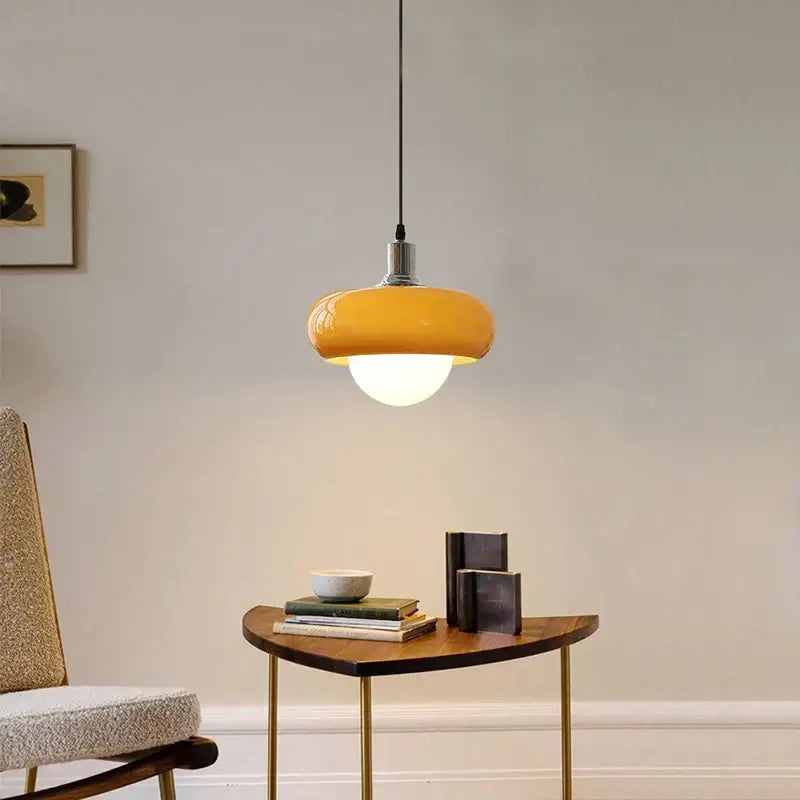 DecorBites led pendant light in warm yellow glass with metallic accents for modern bedroom and dining room decor