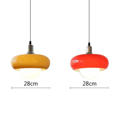 Two vibrant 28cm amber and red glass decorbites led pendant lights with black cords for modern bedroom and dining room