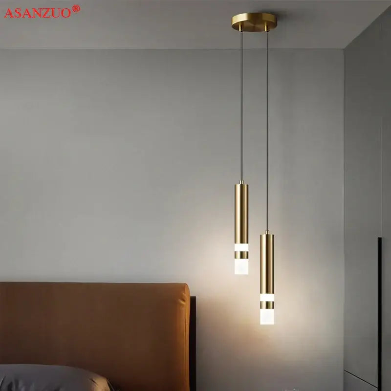 Gold-toned cylindrical decorbites led pendant light with frosted glass accents for modern minimalist spaces