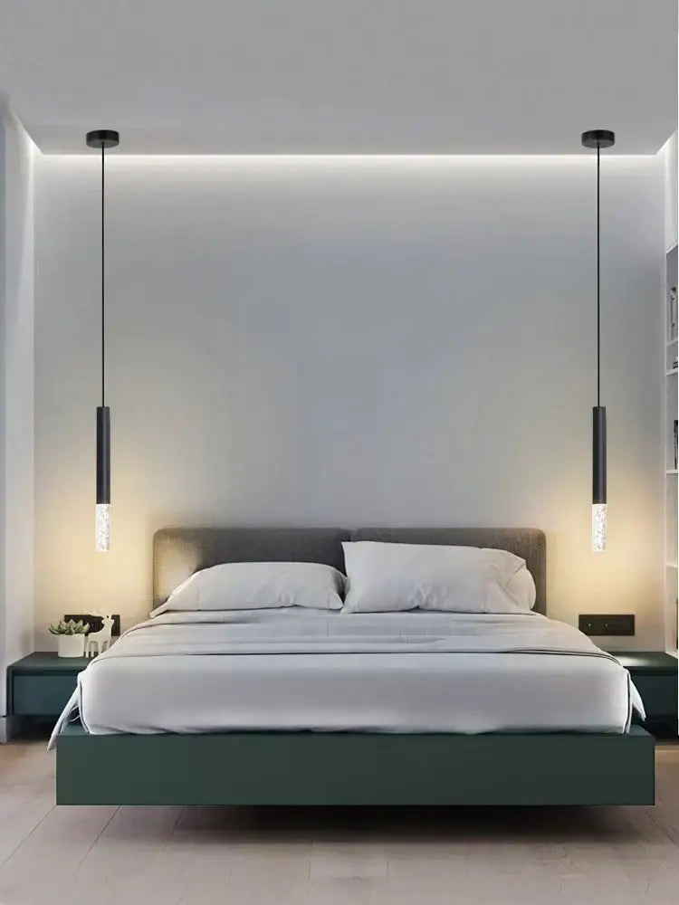 Modern black decorbites led pendant light with cylindrical glass shades hanging above bed for living room use