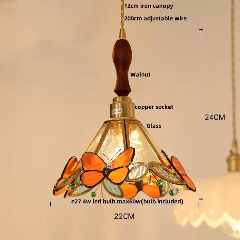 DecorBites™ led pendant light with warm-toned stained white glass, intricate butterfly design, copper socket, and walnut wood canopy