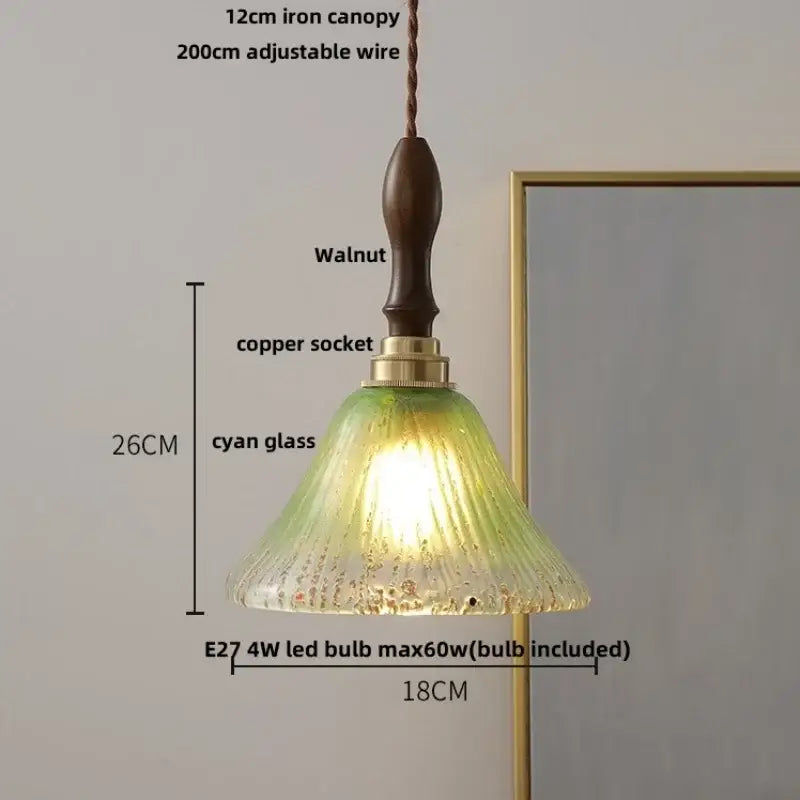 Decorbites™ led pendant light with textured cyan glass shade and walnut wood canopy features warm glowing illumination