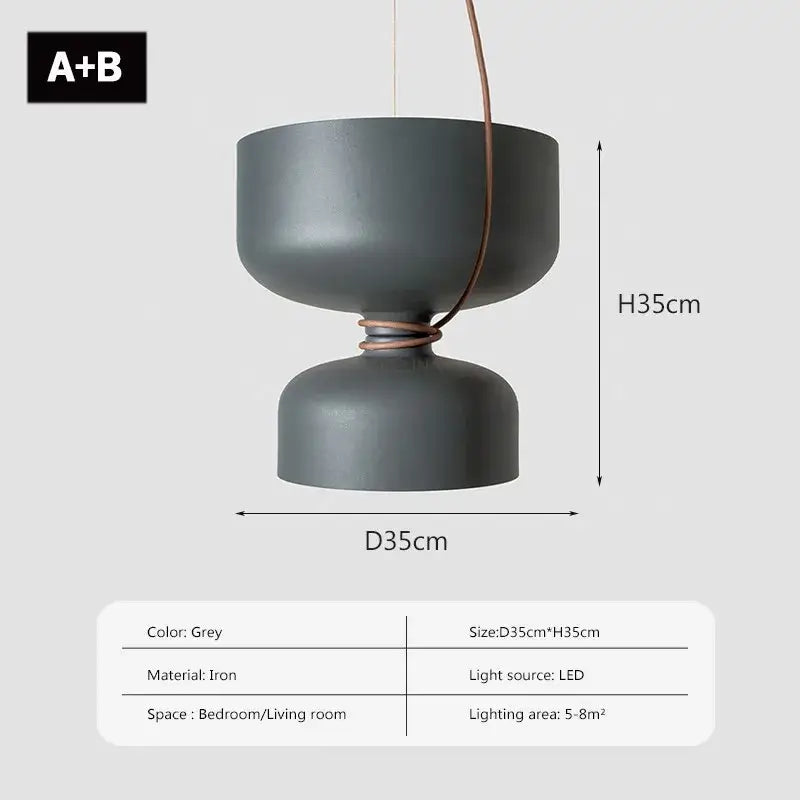 A sleek matte grey iron decorbites led pendant light with copper cable and modern two tiered design for versatile use