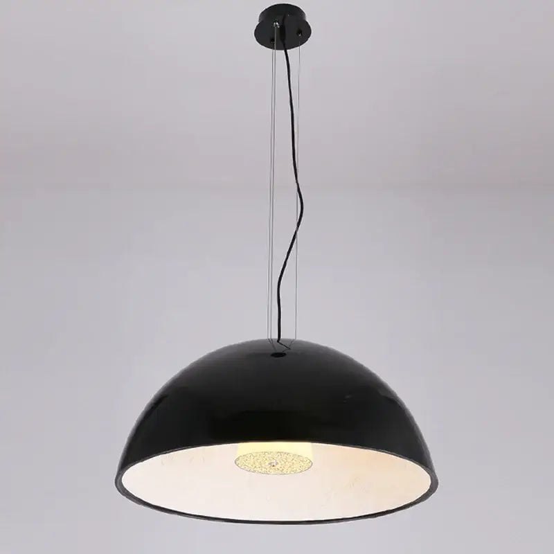 Black dome-shaped DecorBites LED pendant light with glossy finish and illuminated textured bulb for indoor decor