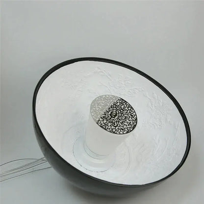 A sleek black and white ceramic bowl with embossed floral pattern featured alongside decorbites led pendant light