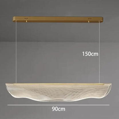 A modern gold-finished DecorBites LED pendant light with a translucent wave-patterned glass shade for living rooms