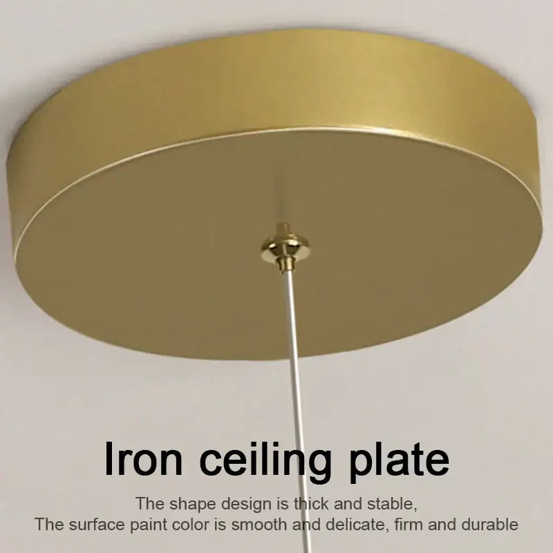 Gold-finished iron ceiling plate with circular design and central rod for decorbites led pendant light installation