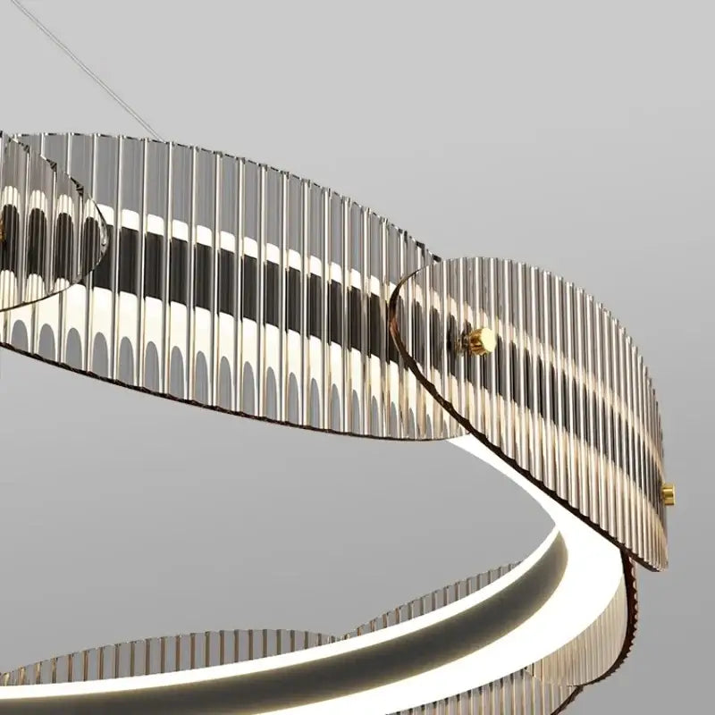 Modern chrome-finished decorbites led pendant light with sleek curved ribbed design and integrated led lighting