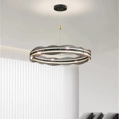 Modern black and gold ring-shaped decorbites led pendant light with sleek wavy design for living and dining spaces
