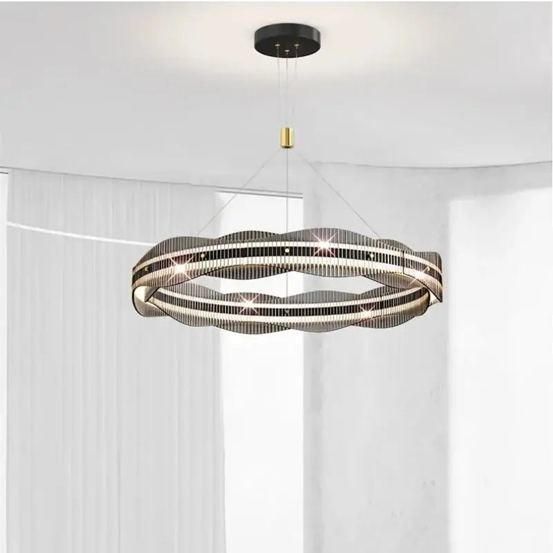 Modern circular DecorBites led pendant light with wavy metallic design and embedded LEDs for living and dining spaces