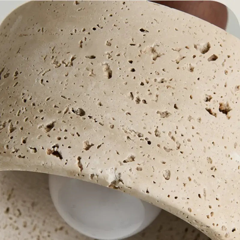 Beige porous stone bowl with textured speckled surface and natural imperfections for decorbites led pendant light