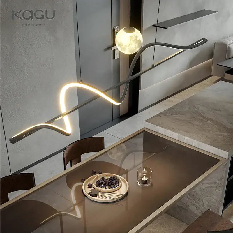 Modern minimalist DecorBites led pendant light with sleek curved metallic arm and illuminated white globe fixture