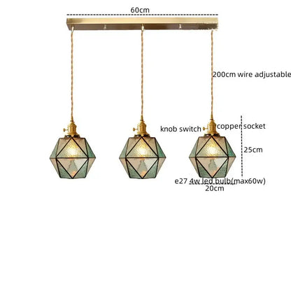 Three geometric pendant lights with brass frames and green stained glass on a 60cm copper bar decorbites led pendant light