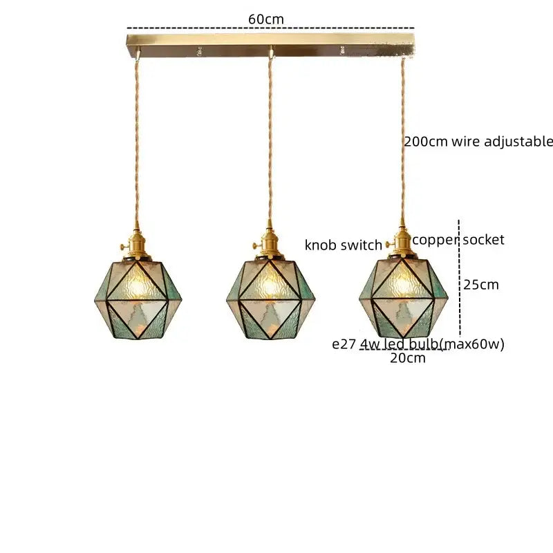 Three geometric pendant lights with brass frames and green stained glass on a 60cm copper bar decorbites led pendant light