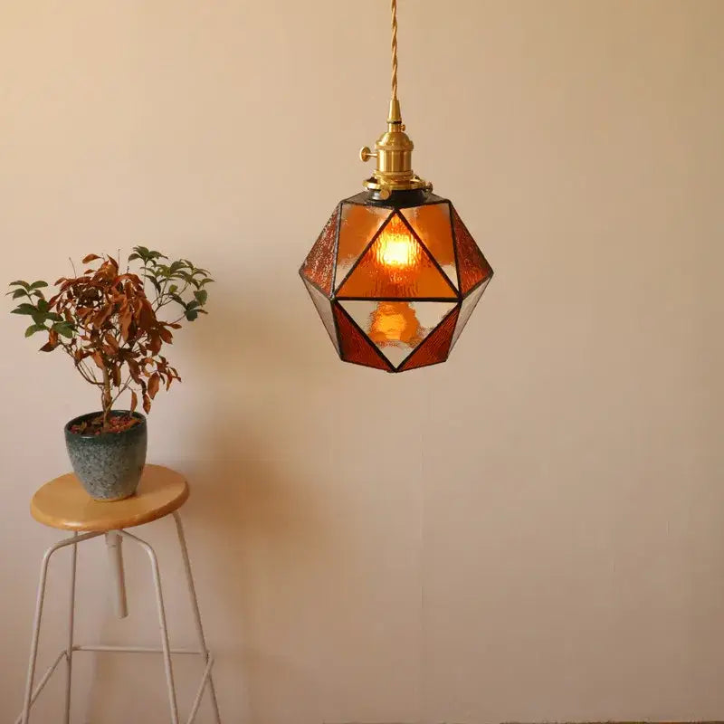 Decorbites led pendant light with warm amber geometric shade brass hardware and twisted cord for bedroom or dining room