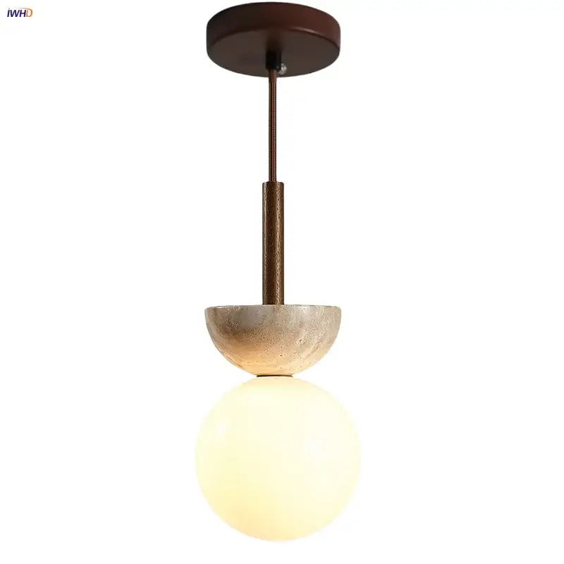 Modern decorbites led pendant light with matte bronze mount, textured concrete half-sphere, and frosted glass globe