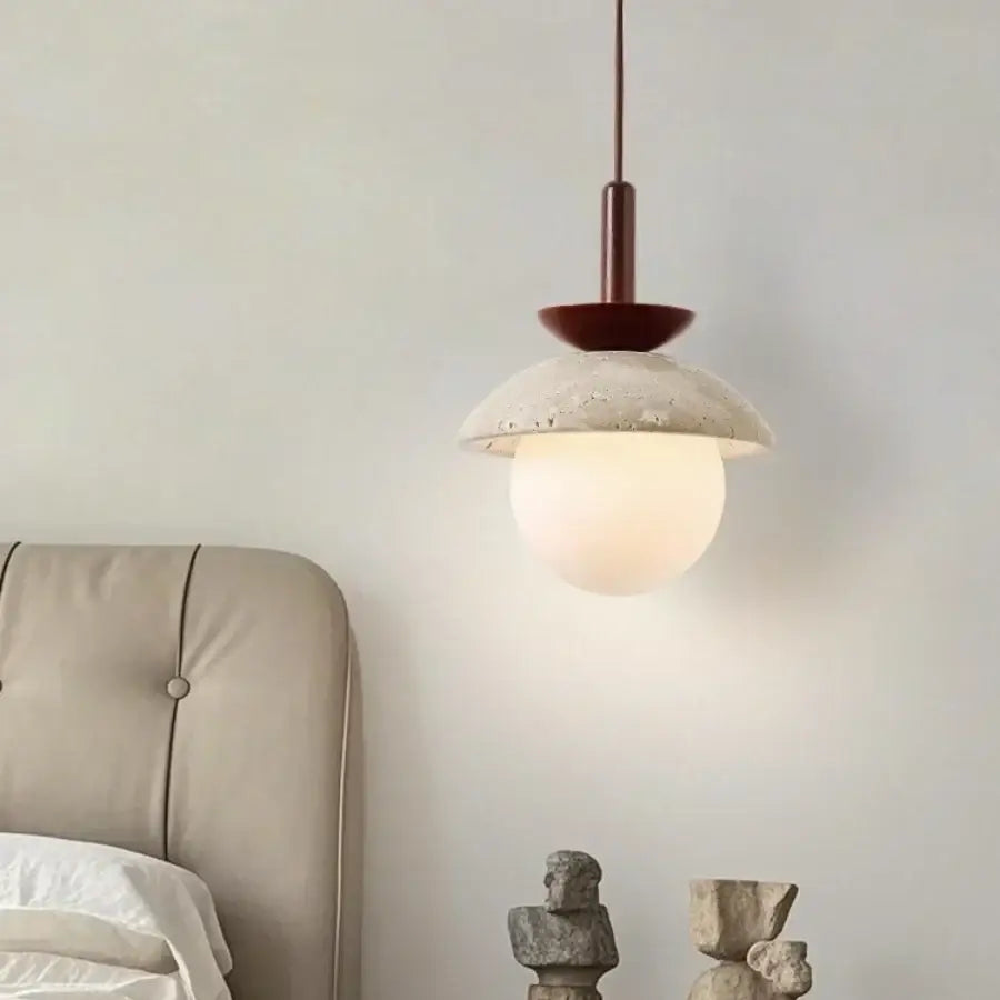 DecorBites led pendant light with a matte red metal fixture and off-white concrete shade above frosted glass globe