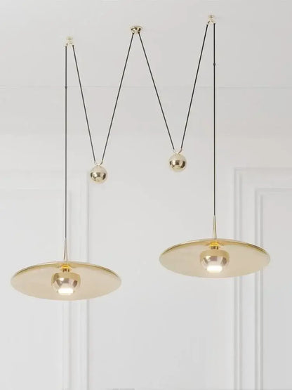Gold-toned DecorBites LED pendant lighting lamp with minimalist circular shades and adjustable black cords for bedroom use