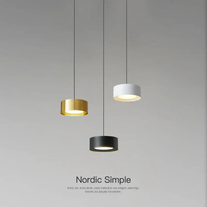 Three minimalist decorbites led pendant lights with gold white and black cylindrical shades for modern home decor