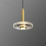 Gold-finished decorbites led pendant light with circular crystal diffuser and central illuminated bulb for indoor use