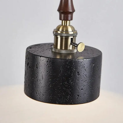 Black textured concrete lamp base with brass socket and dark wood stem for decorbites led pendant black travertine light