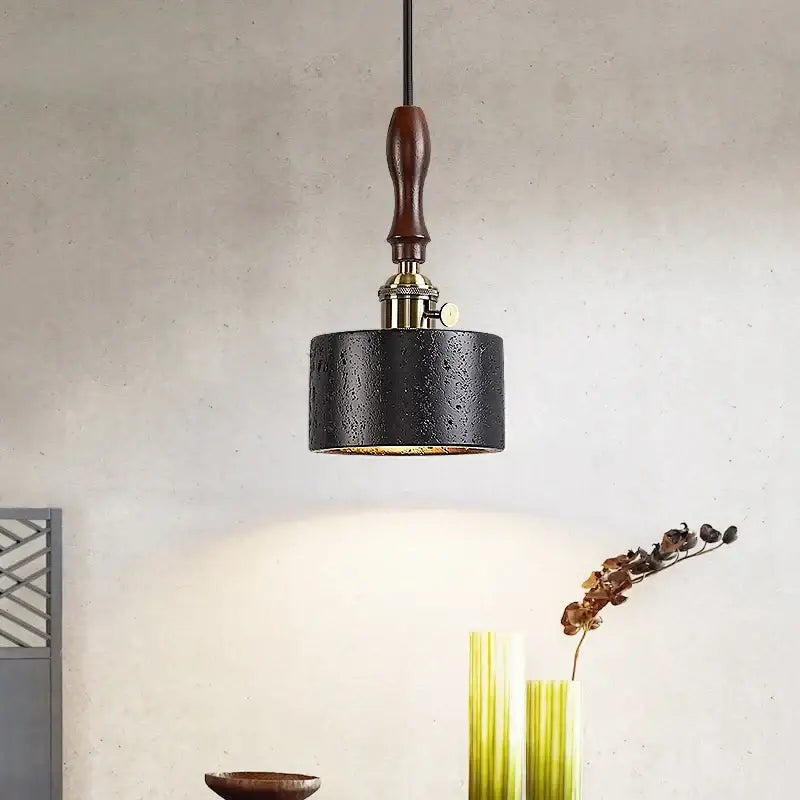 Black textured metal pendant light with wooden handle and brass accents by DecorBites LED pendant for bedroom use