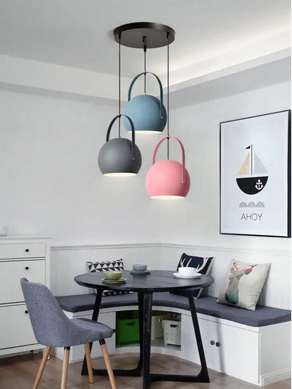 Three matte pastel spherical pendant lights in blue gray and pink from decorbites led pendant lights for dining areas