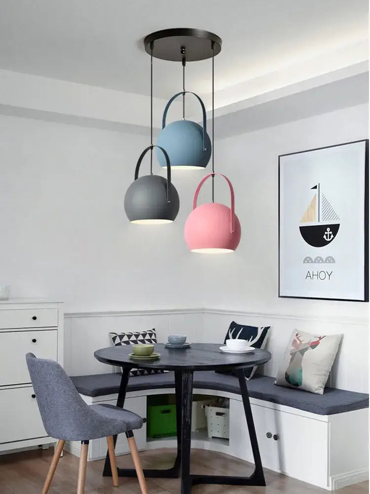 Three matte pastel spherical pendant lights in blue gray and pink from decorbites led pendant lights for dining areas