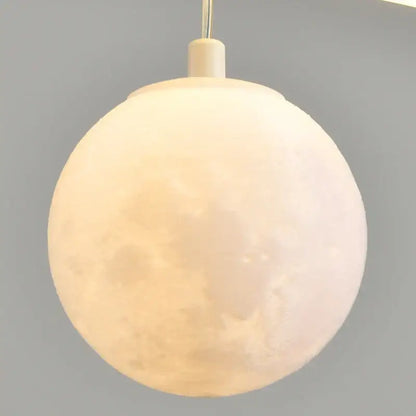 Decorbites led pendant lights featuring a matte white moon-shaped spherical design with detailed lunar texture for dining rooms