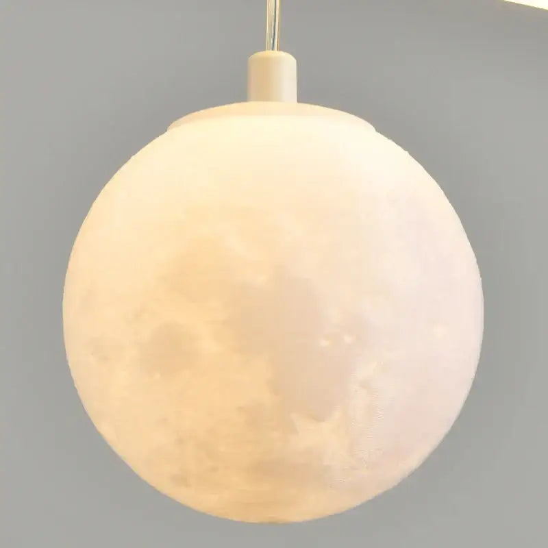 Decorbites led pendant lights featuring a matte white moon-shaped spherical design with detailed lunar texture for dining rooms